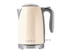 Cream-colored electric kettle with chrome accents and '1973' embossed on the front