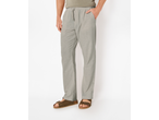 Man wearing light grey lounge pants with a drawstring waist and brown sandals.