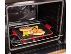 Placa de grelha de ferro fundido SILVERCREST com frango e vegetais no forno.