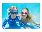 Two people in swim goggles and swimwear underwater, smiling at the camera.