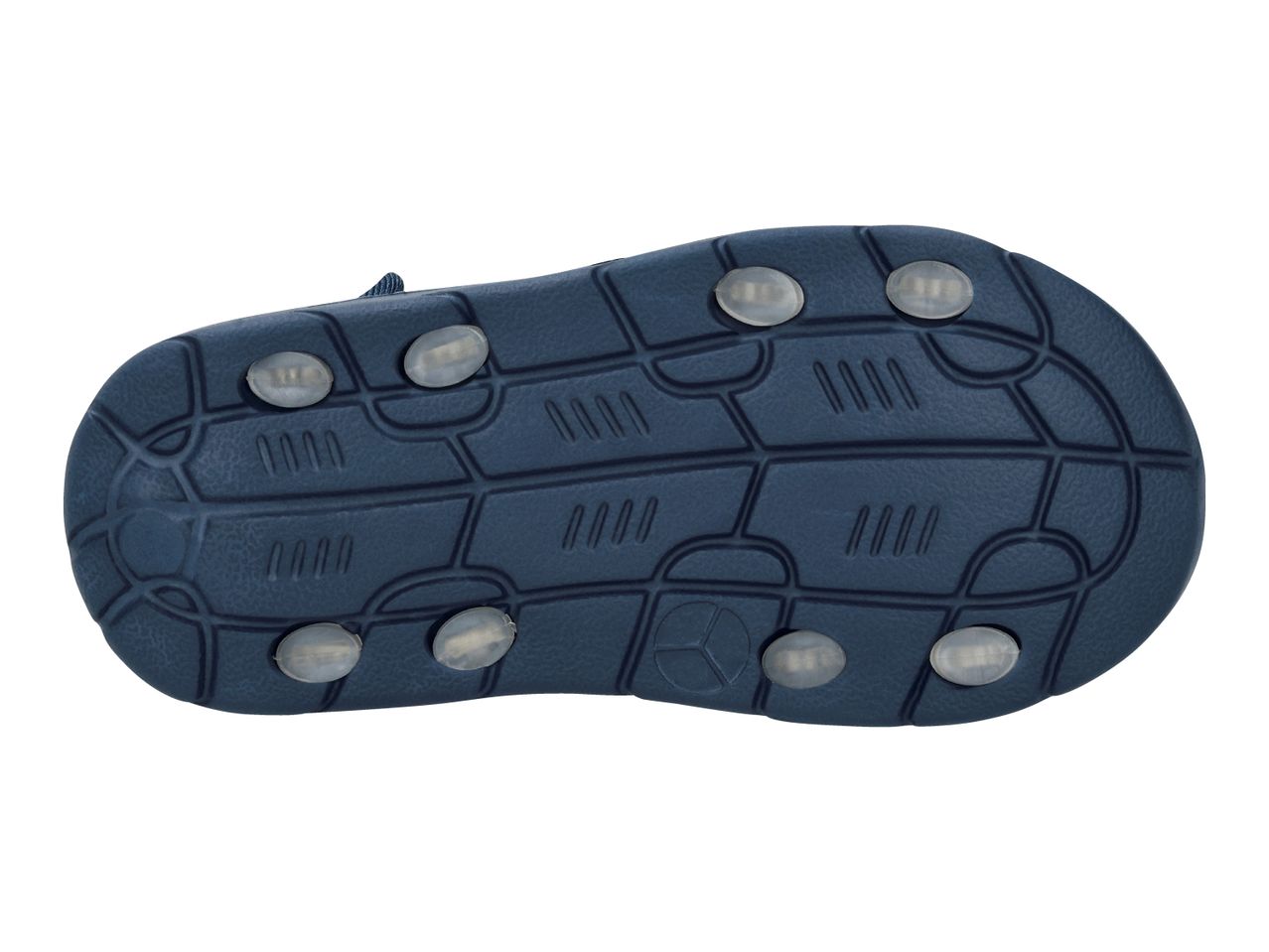 Bottom view of a dark blue children's sandal with light-colored, oval-shaped inserts on the sole.