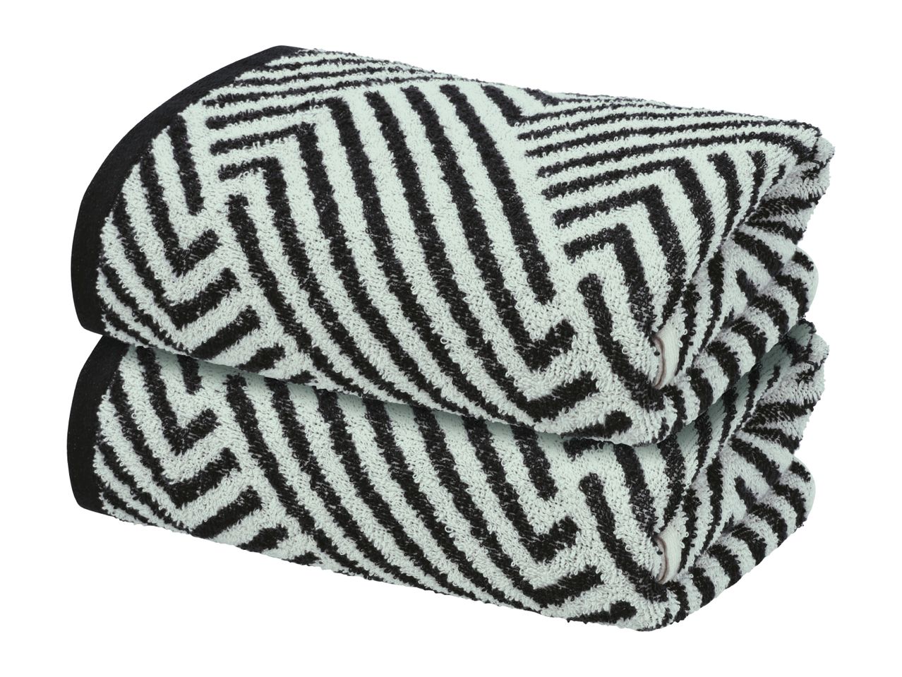 Two folded towels with a black and white geometric pattern, stacked on top of each other.
