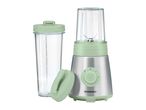 A light green and silver personal blender with two clear blending cups, one with a lid.