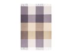 Plaid blanket with fringes in shades of purple, beige, and white.