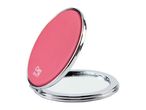 A pink compact mirror with a silver frame.