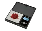 Balança de cozinha digital SILVERCREST com flocos de pimenta vermelha na plataforma.