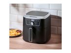 Silvercrest air fryer with fries and ketchup on a wooden counter.