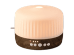 Beleuchteter Aroma-Diffuser in Holzoptik mit Tastensteuerung.