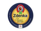Rund emballage til smelteost med en kvinde og en firkløver, teksten 'Classic'.