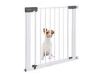 Safety 1st baby gate with a small dog behind it.