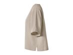 Beige short-sleeved top with a textured fabric, shown from a side angle.