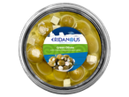 Overhead view of a jar of green olives with cheese filling and cheese cubes, Greek style.
