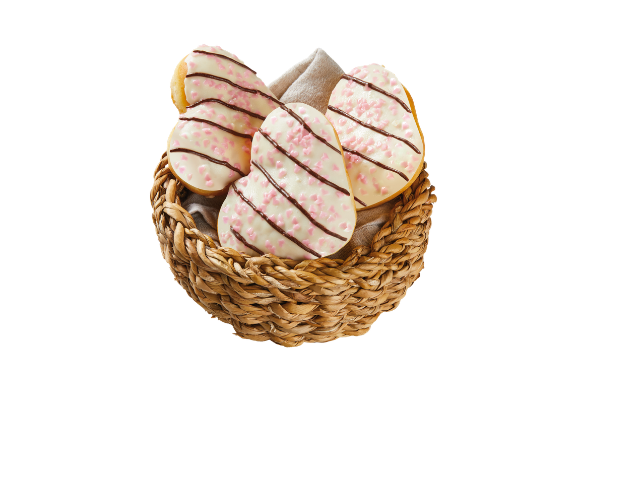 Donuts em forma de coração, com cobertura branca, granulado rosa e chocolate, em uma cesta.