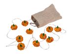 Pumpkin-shaped string lights spilling from a burlap bag.