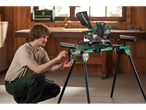 A man assembles a Parkside miter saw stand.
