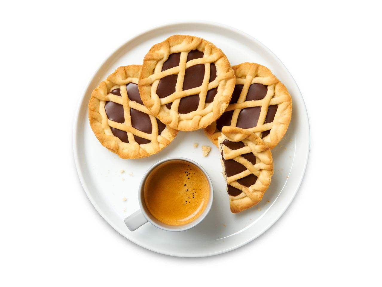 Chocolate tarts with a cup of espresso on a white plate.
