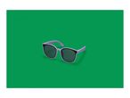 Purple sunglasses with dark lenses on a green background.