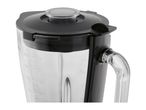 Close-up of a glass blender jar with a black lid and measurement markings