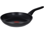 Black frying pan with a red heat indicator in the center, angled view.