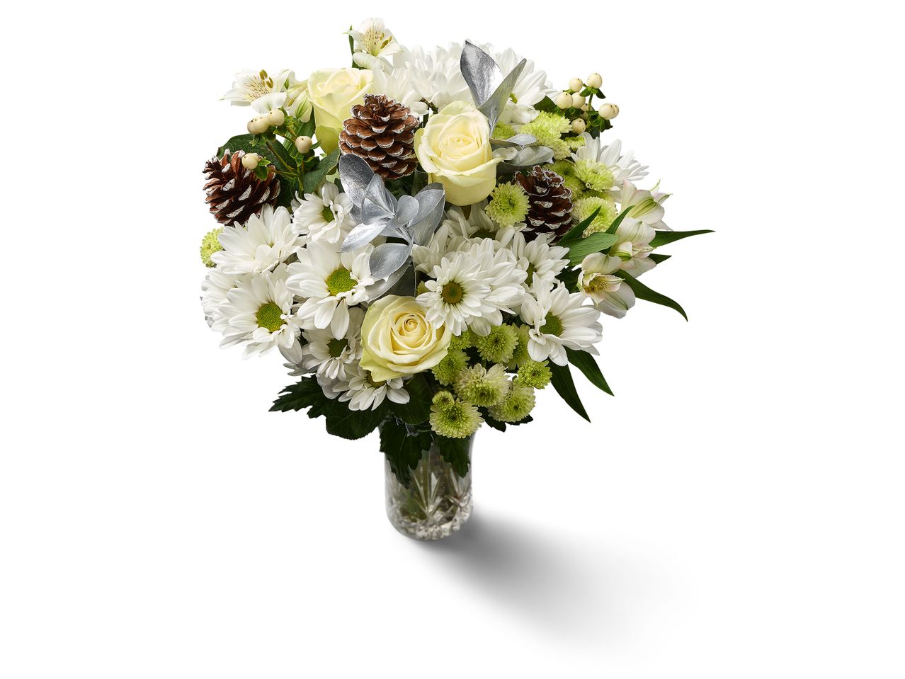 White and green floral bouquet with pinecones and silver accents in a clear vase.