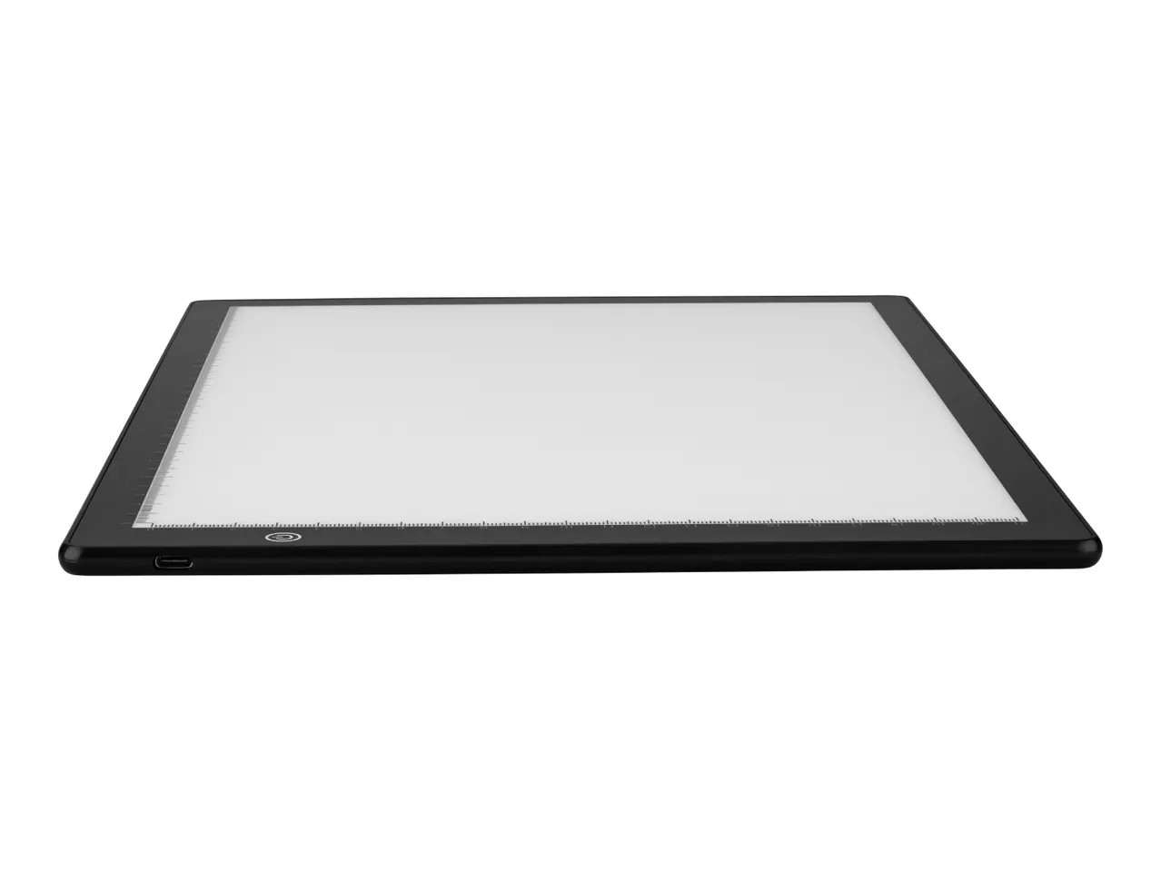 A black light pad with a white illuminated surface and rulers on the edges.