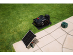 PARKSIDE PERFORMANCE robotic lawnmower with solar panel and charging station in the garden.