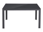 Dark grey rectangular outdoor dining table with a glass top and metal frame.