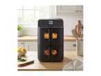 Black dual air fryer with fries and chicken wings in a bright kitchen setting.