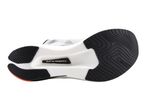 Underside of a white running shoe with black sole patterns and a visible carbon plate.