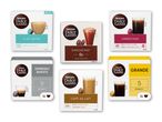 Seks pakker kaffekapsler, herunder Flat White, Chococino, Americano, Espresso Barista, Café au Lait og Grande.