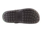 The bottom of a black clog shows a textured sole.