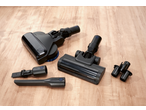 SILVERCREST® Cordless Cyclone Handheld Vacuum Cleaner with various attachments on a wooden floor.