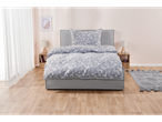 Grey upholstered bed with blue paisley bedding set.