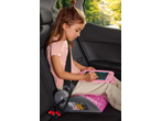 Girl in car seat using a pink Tronic LCD Writing Tablet with a drawing of hearts.