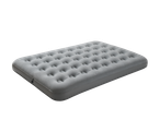 Grey inflatable air mattress with a textured surface on a black background.