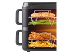 Air fryer with salmon, green beans, fried chicken, and french fries