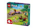 A LEGO Friends set featuring a purple and yellow vehicle with a trailer, two horses with riders, and a horse jumping obstacle.