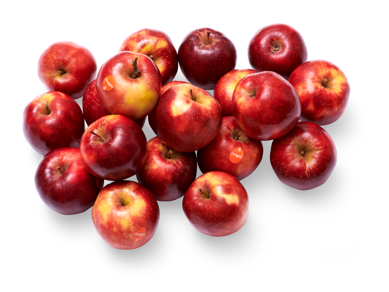Een hoop Jonagold appels op een zwarte achtergrond.