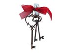 Three antique-style keys with a red ribbon, hanging from a clear hook.