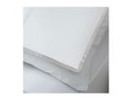 White pillow with a light grey trim and a small purple label, resting on a white sheet.
