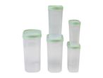 Set of four clear plastic food storage containers with light green lids.