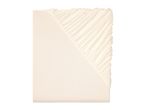 Light beige fitted sheet.