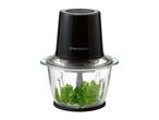 Black food chopper with a glass bowl filled with parsley