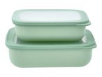 Two stacked rectangular food storage containers with light green bases and translucent lids.