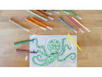 Colouring pens and a child's drawing of a green octopus in a space helmet.