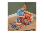 A child playing with a wooden toy truck, tools, and car maintenance accessories.