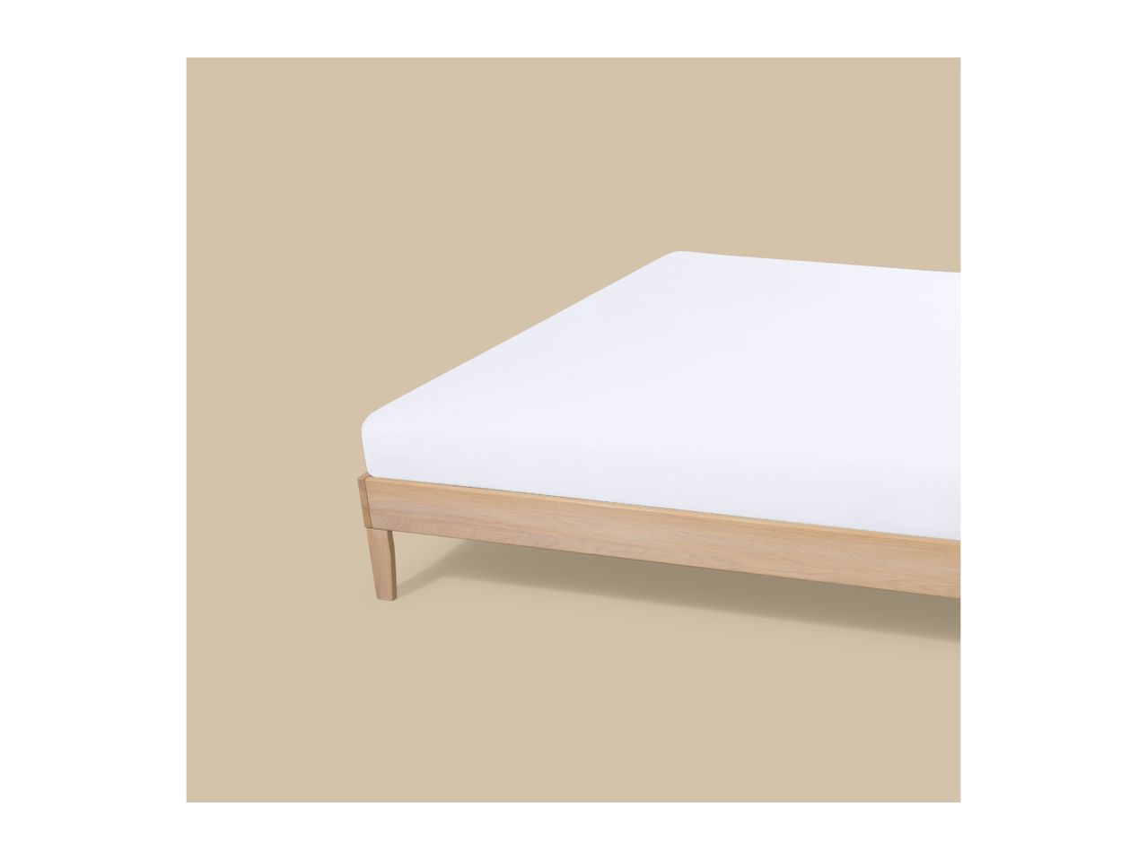 A wooden bed frame with a white mattress on a beige background.