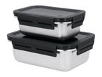 Two stacked stainless steel food containers with black lids and clasps.