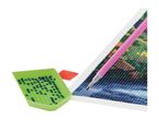 Diamond painting kit with a pen, tray of beads, and a partially completed canvas.