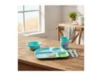 Children's dining set with a divided plate, bowl, cup, spoon, and fork on a wooden table.